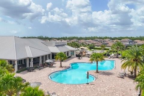 17311 Blue Ridge Place Bradenton, FL 34211 - Photo 43 of 55 an aerial view of a house with swimming pool and lake view