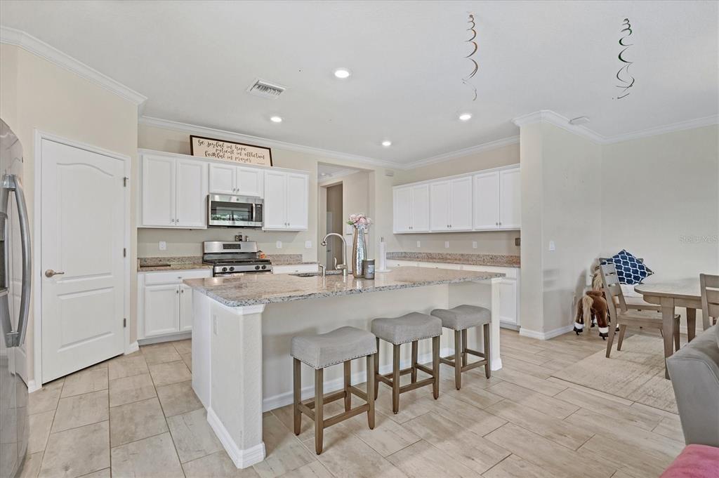 17311 Blue Ridge Place Bradenton, FL 34211 - Photo 8 of 55 a kitchen with appliances a sink and cabinets