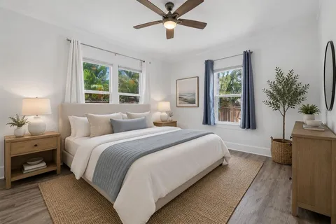 a bedroom with bed and window