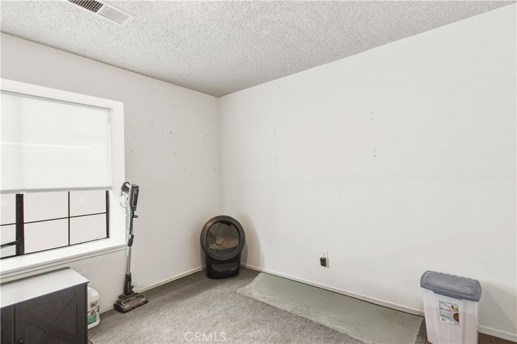 1418 Nut Tree Road Livingston, CA 95334 - Photo 4 of 33 a view of a room with rack on the wall