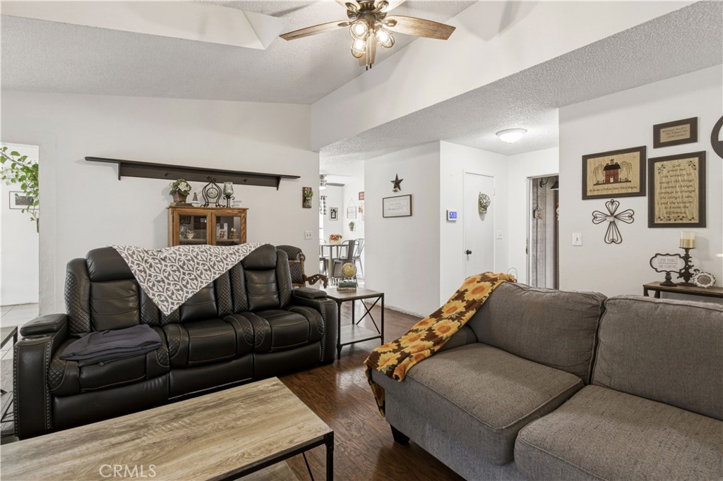 1418 Nut Tree Road Livingston, CA 95334 - Photo 8 of 33 a living room with furniture and a chandelier
