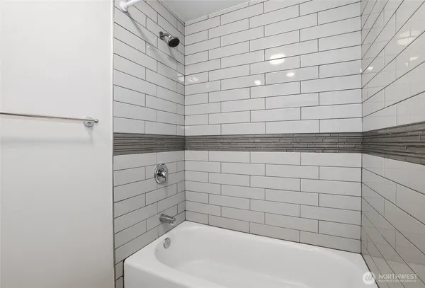 a bathroom with a white bathtub