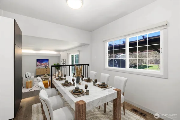 a view of a dining room with furniture window and outside view