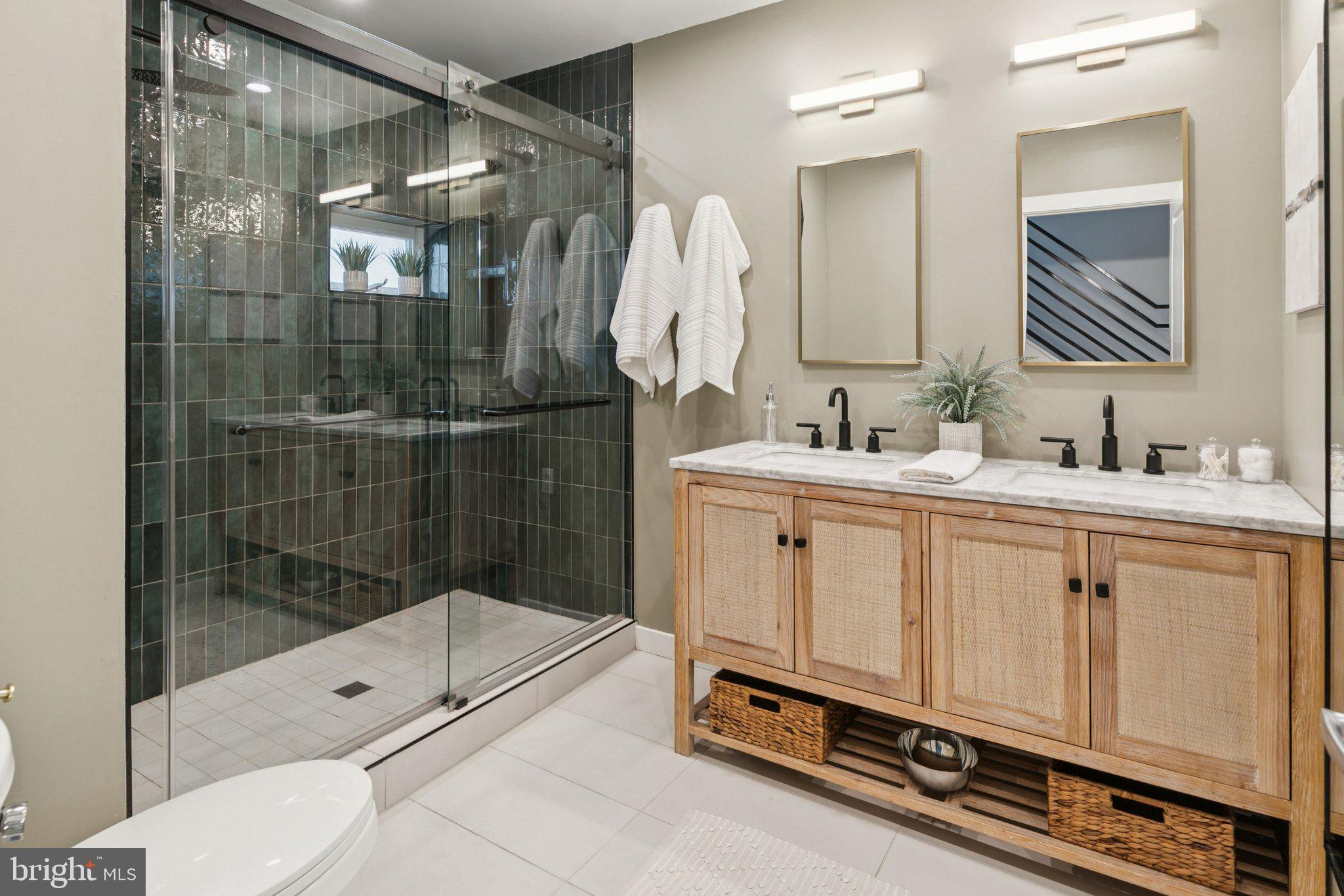 1537 Reed Street Philadelphia, PA 19146 - Photo 16 of 32 a bathroom with a double vanity sink mirror and shower