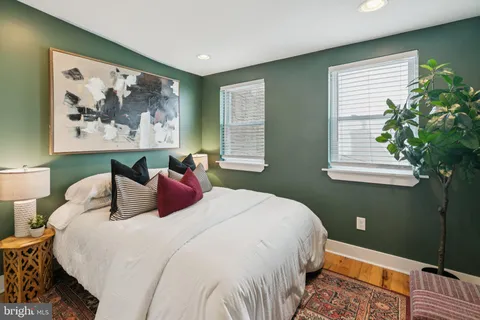 a bedroom with bed and a window