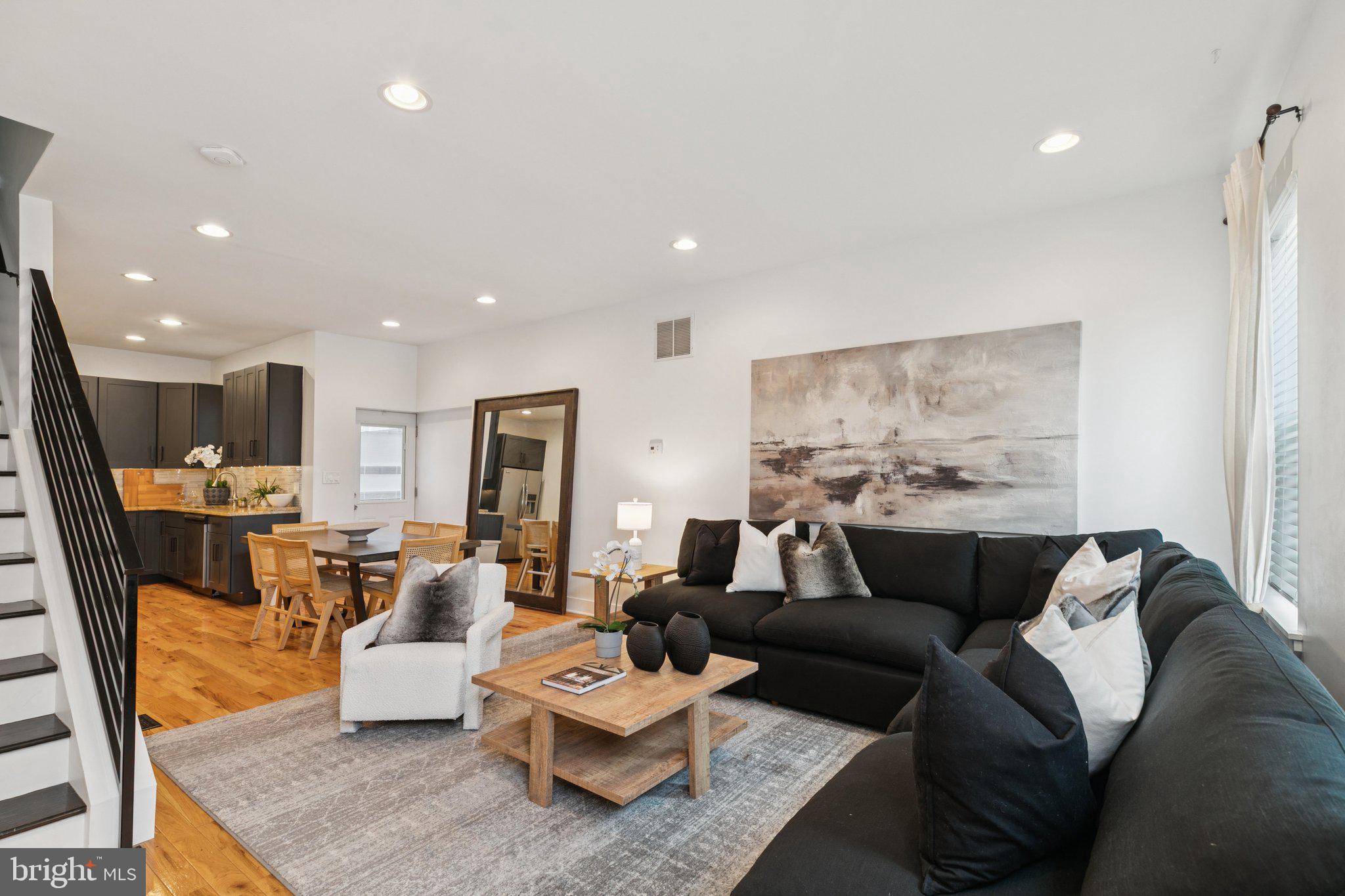 1537 Reed Street Philadelphia, PA 19146 - Photo 2 of 32 a living room with furniture wooden floor and a large window