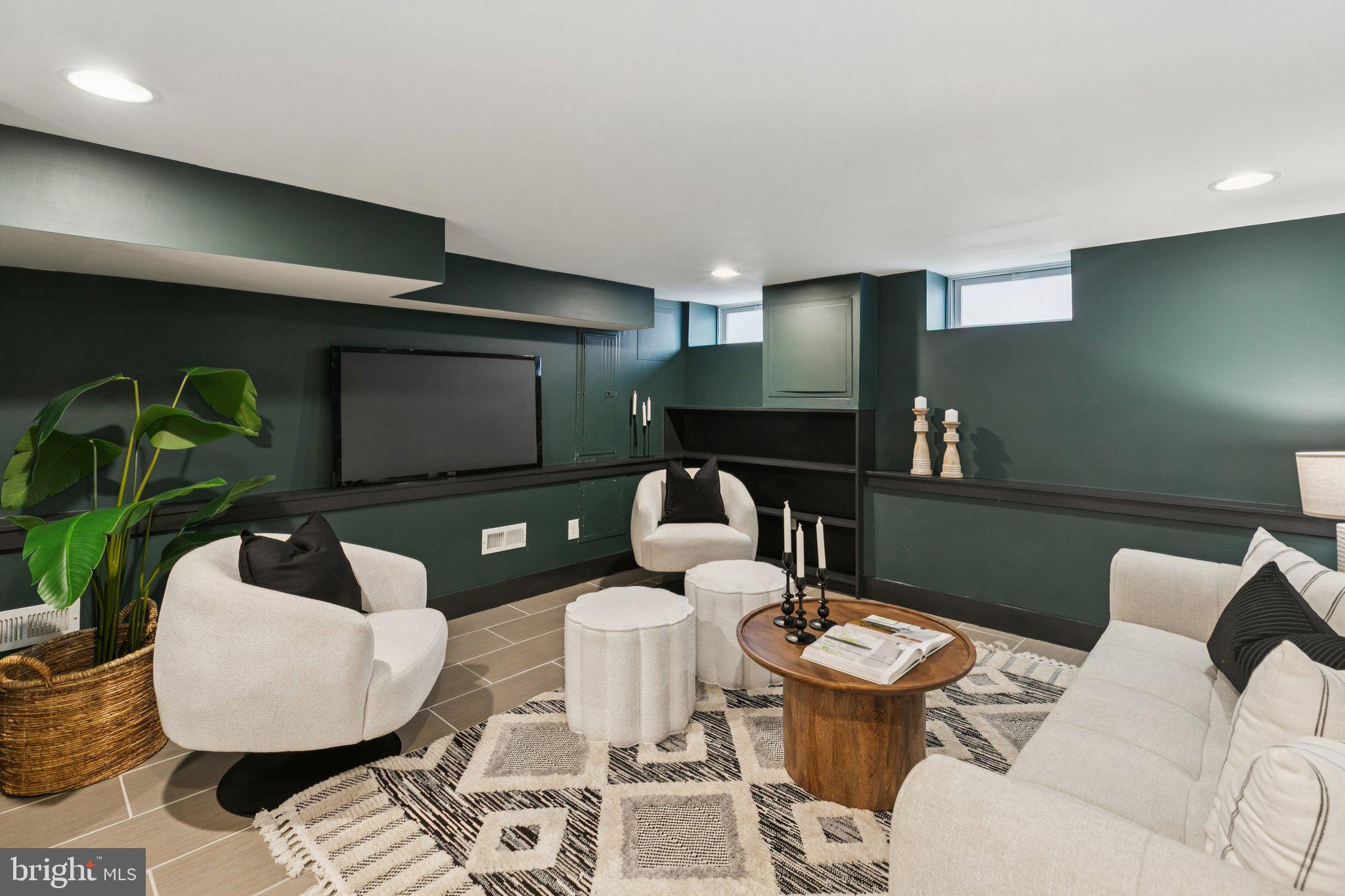 1537 Reed Street Philadelphia, PA 19146 - Photo 25 of 32 a living room with furniture and a flat screen tv