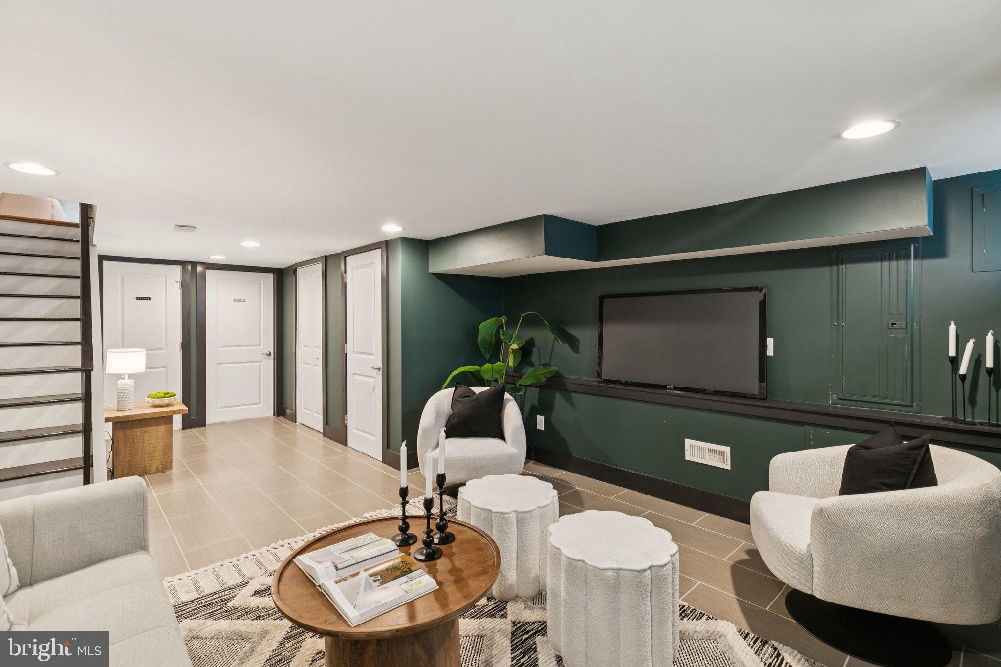 1537 Reed Street Philadelphia, PA 19146 - Photo 26 of 32 a living room with furniture and a flat screen tv