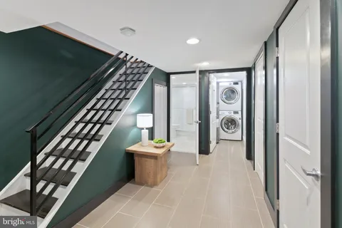 a entryway with stairs and furniture