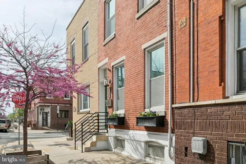 a front view of a building with glass windows