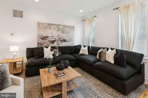 a living room with furniture and a couch
