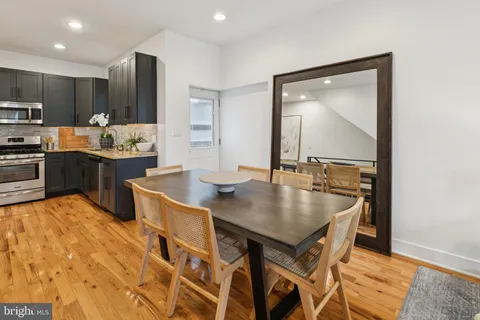 a kitchen with a table and chairs in it