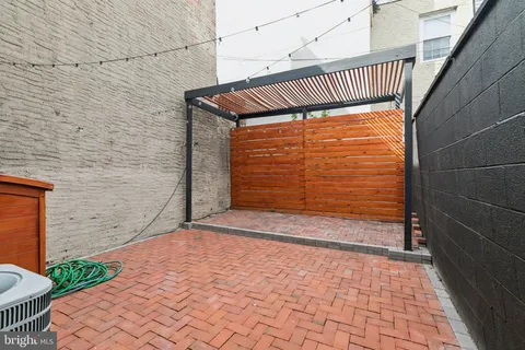 a view of a brick wall with an empty room