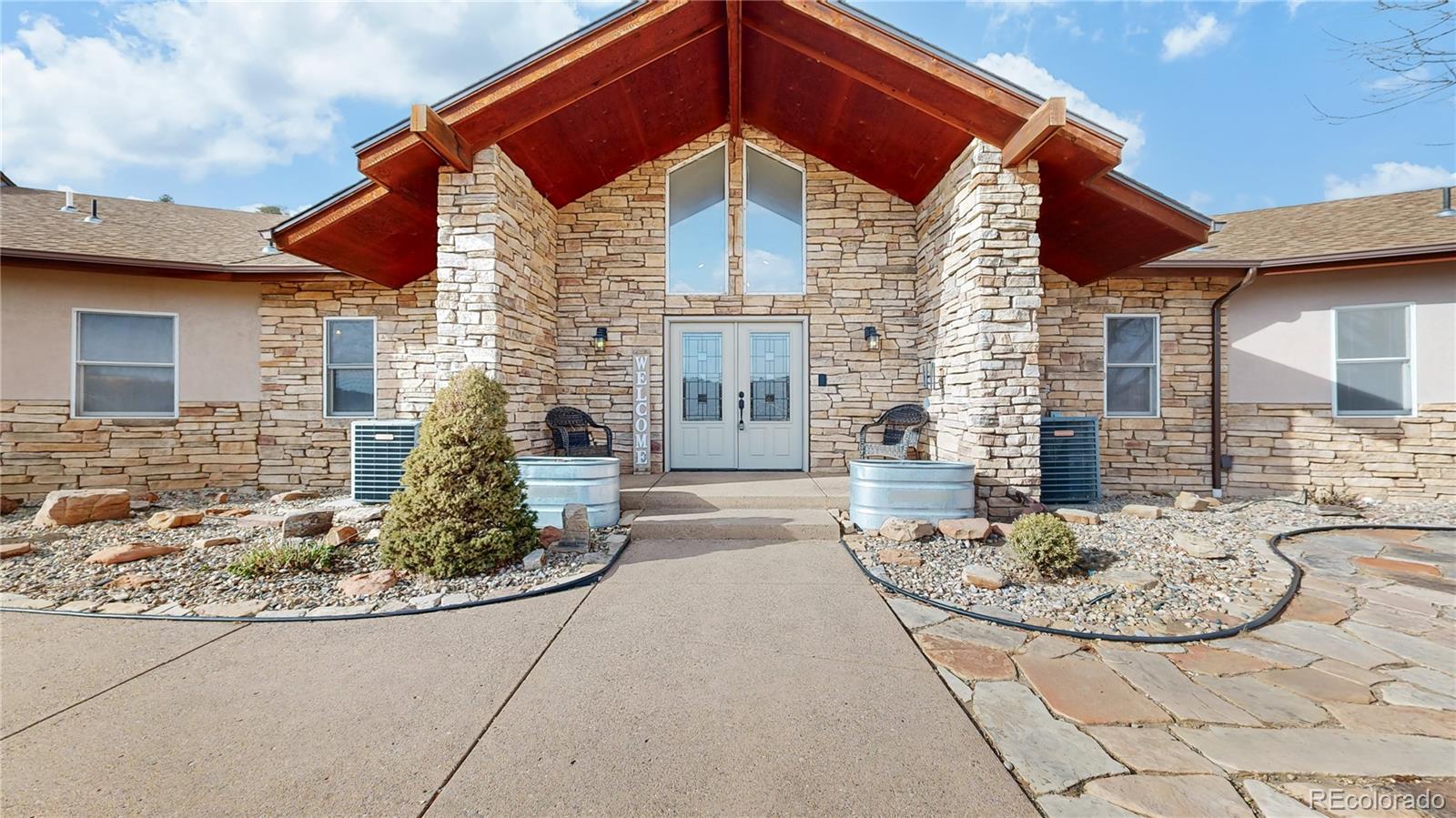 5575 Spring Glade Road Loveland, CO 80538 - Photo 2 of 49 a front view of a house