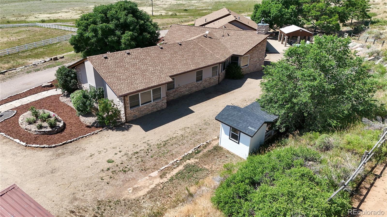 5575 Spring Glade Road Loveland, CO 80538 - Photo 43 of 49 an aerial view of a house with garden space and ocean view