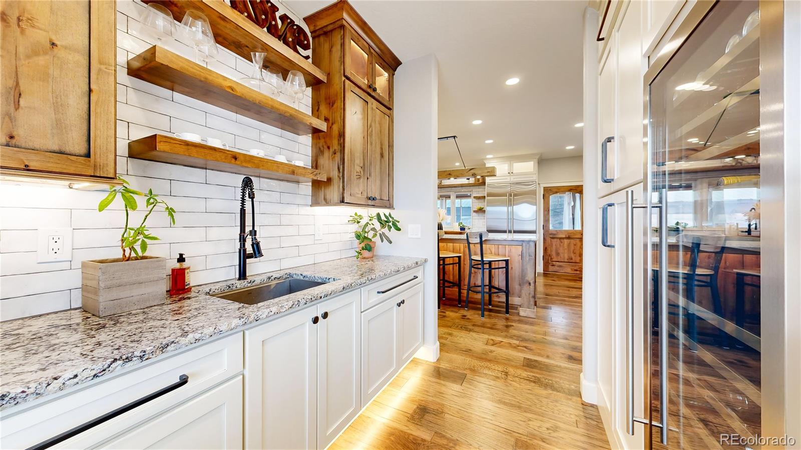 5575 Spring Glade Road Loveland, CO 80538 - Photo 6 of 49 a kitchen with counter top space and a sink