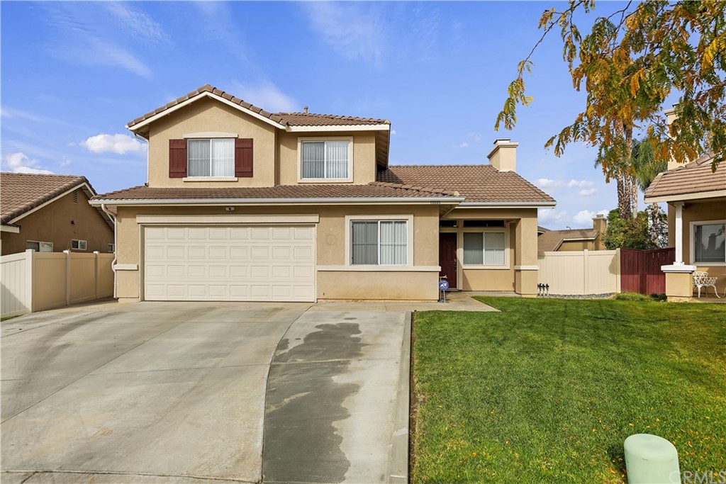 19590 Jill Court Riverside, CA 92508 - Photo 1 of 1 a front view of a house with a yard and garage