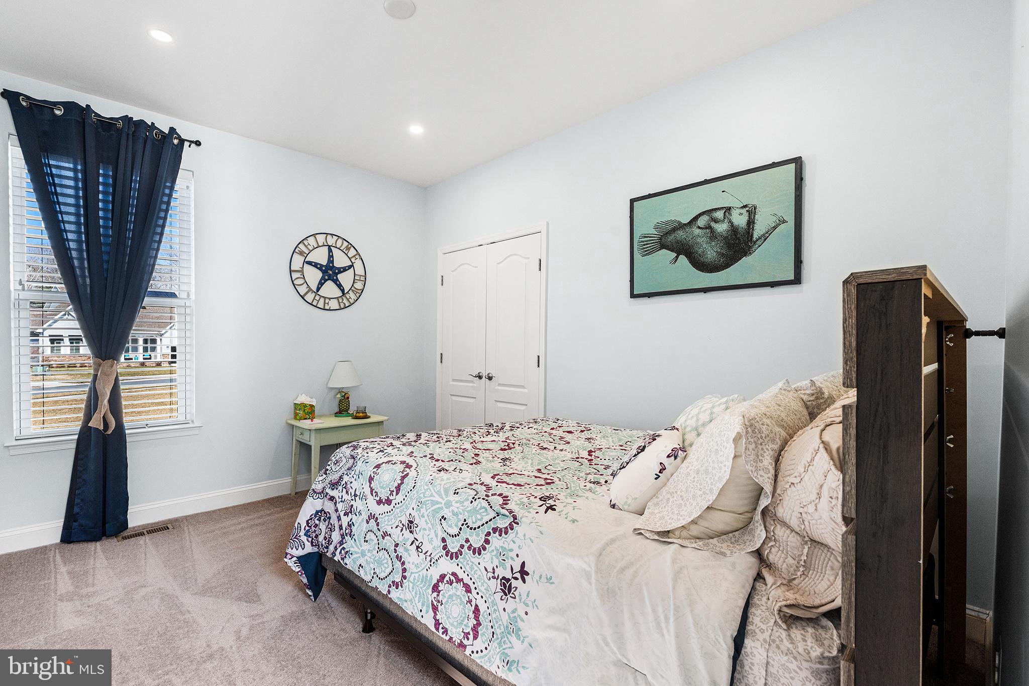 36207 Watch Hill Road Frankford, DE 19945 - Photo 18 of 35 a bedroom with a bed and a wall painting