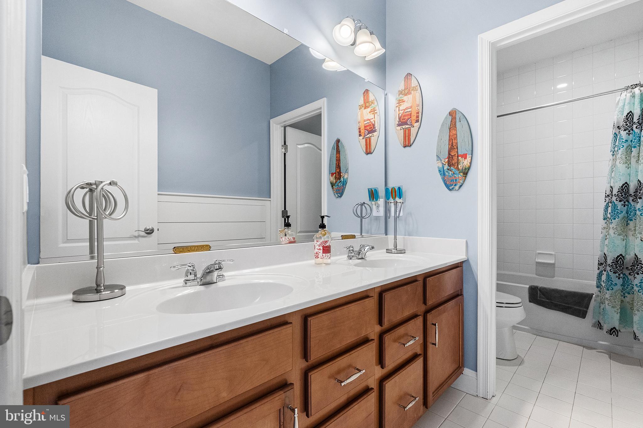 36207 Watch Hill Road Frankford, DE 19945 - Photo 19 of 35 a bathroom with a sink and a mirror