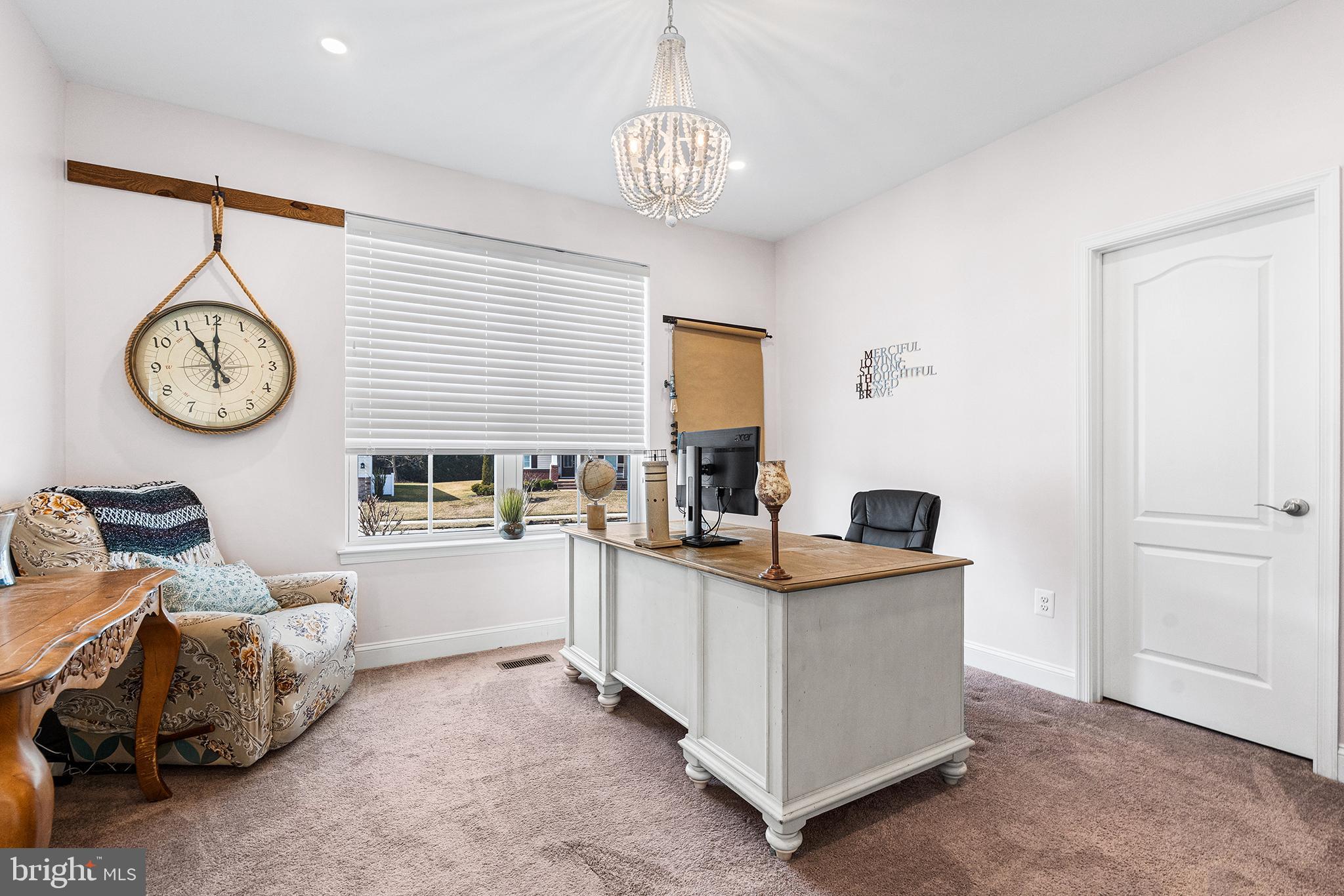 36207 Watch Hill Road Frankford, DE 19945 - Photo 20 of 35 a kitchen with a cabinets and a clock on the wall