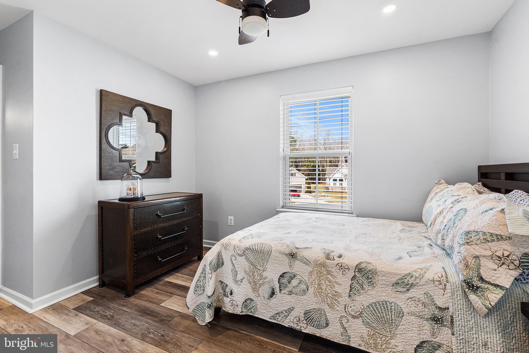 36207 Watch Hill Road Frankford, DE 19945 - Photo 23 of 35 a bedroom with a bed and a dresser