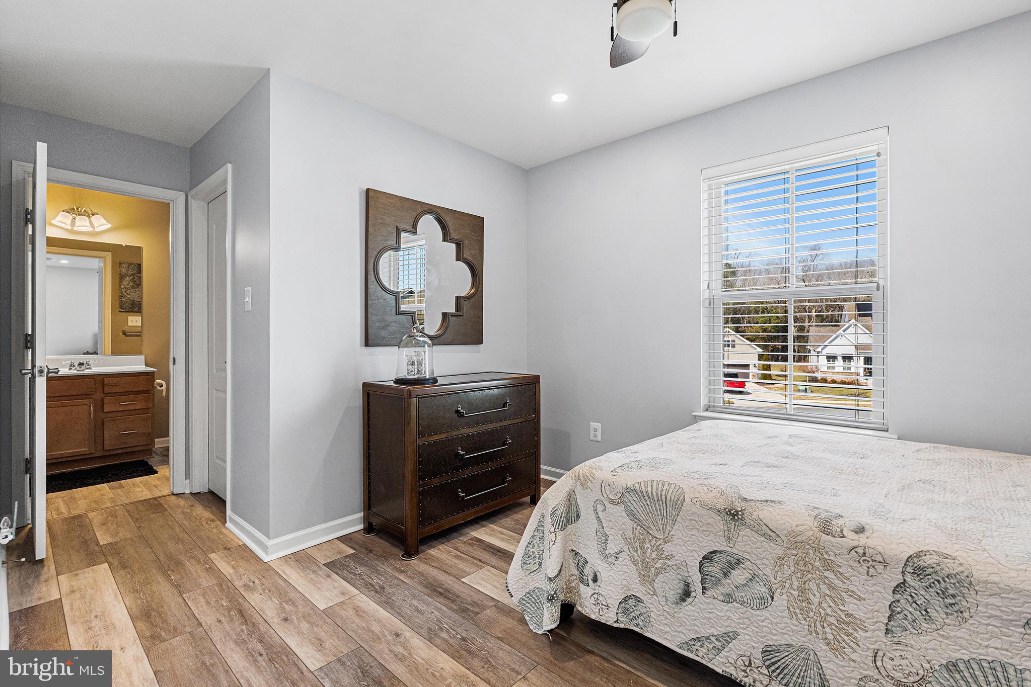 36207 Watch Hill Road Frankford, DE 19945 - Photo 24 of 35 a bedroom with a bed and a dresser