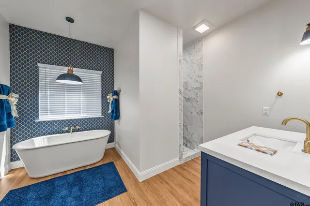 a bathroom with a sink and a bathtub