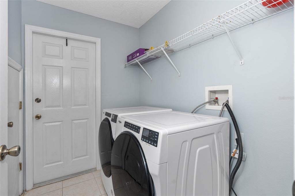 1030 Coventry Road Davenport, FL 33897 - Photo 24 of 48 a utility room with dryer and washer