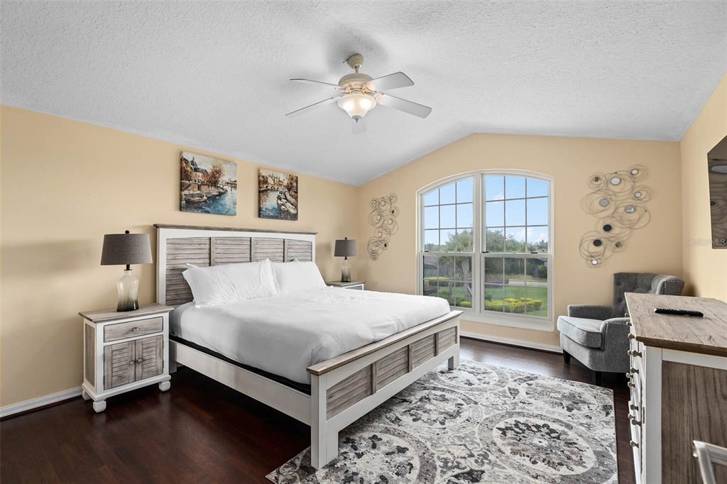 1030 Coventry Road Davenport, FL 33897 - Photo 27 of 48 a bedroom with a bed and a large window with outer view