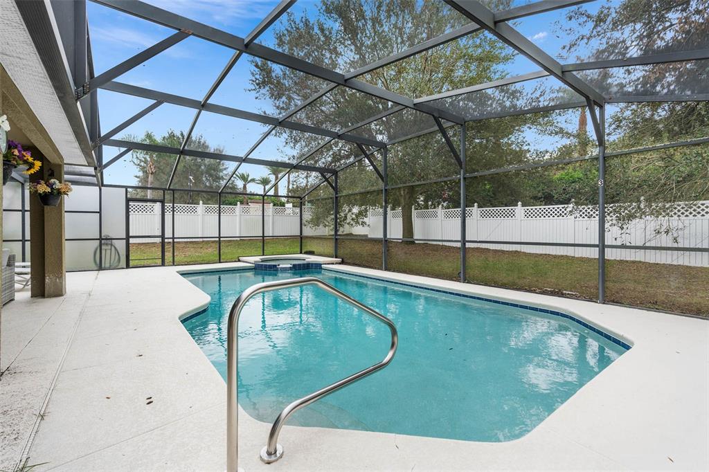 1030 Coventry Road Davenport, FL 33897 - Photo 33 of 48 a view of a swimming pool with a patio and a yard