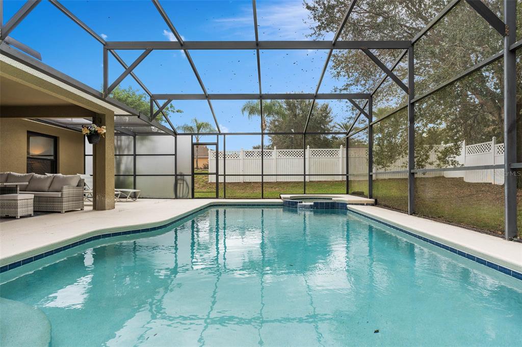 1030 Coventry Road Davenport, FL 33897 - Photo 35 of 48 a swimming pool with a outdoor seating