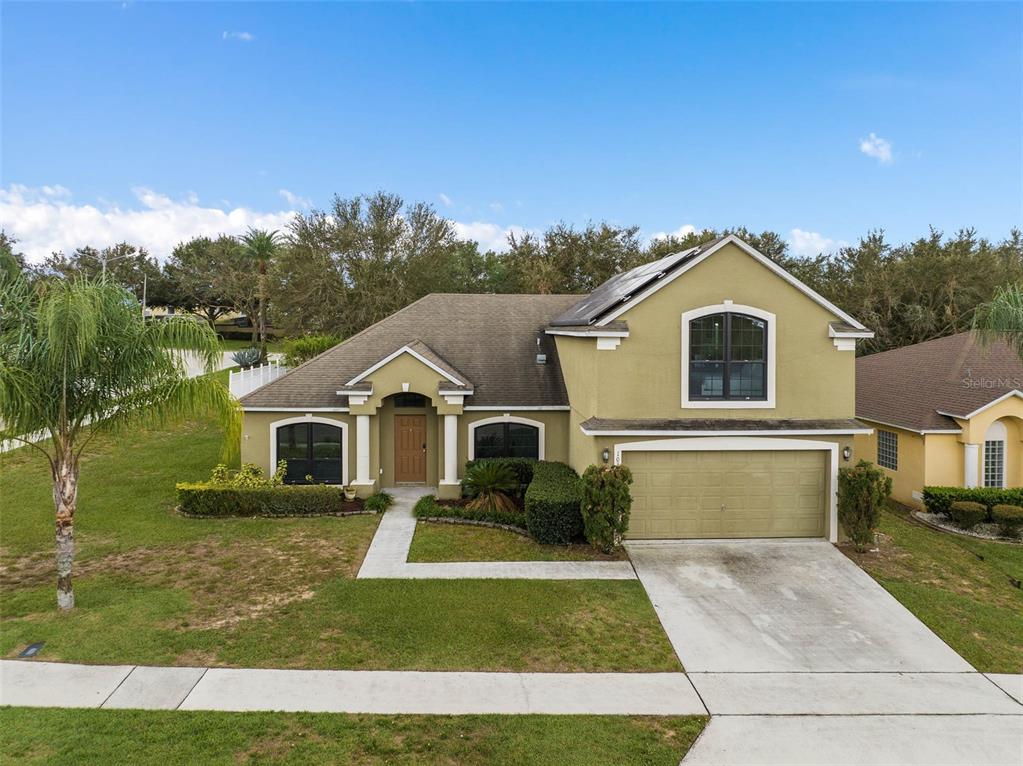 1030 Coventry Road Davenport, FL 33897 - Photo 43 of 48 a front view of a house with a yard