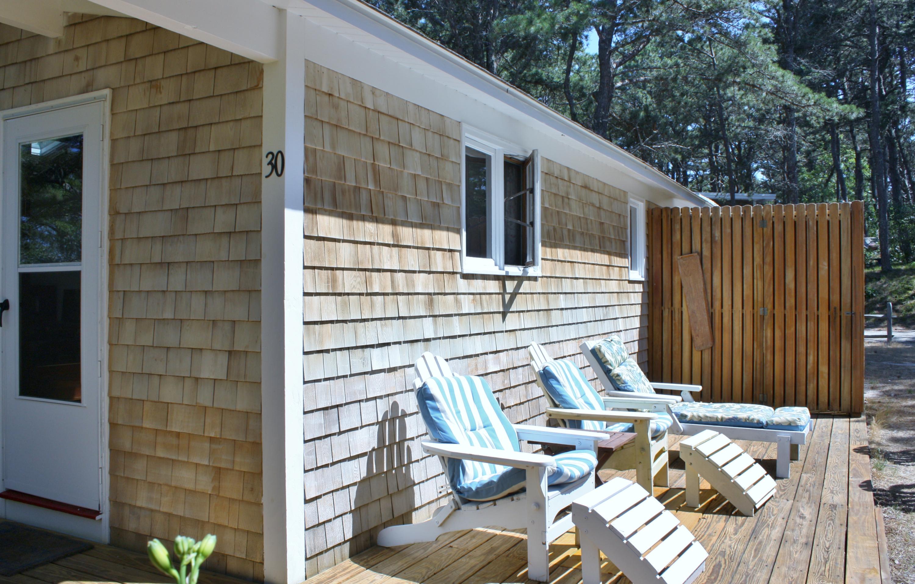30 Fox Island Road, Unit D Wellfleet, MA 02667 - Photo 3 of 29 a view of balcony with wooden floor and outdoor seating
