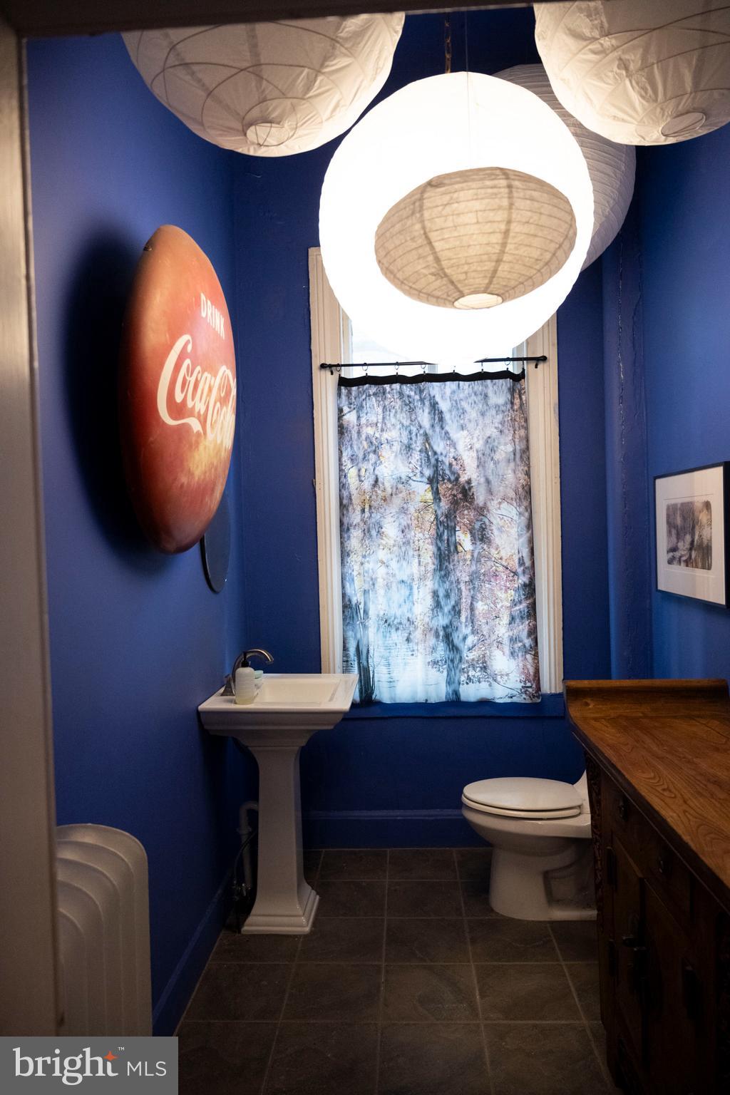 19 South Stricker Street Baltimore, MD 21223 - Photo 23 of 55 a bathroom with a sink mirror and toilet