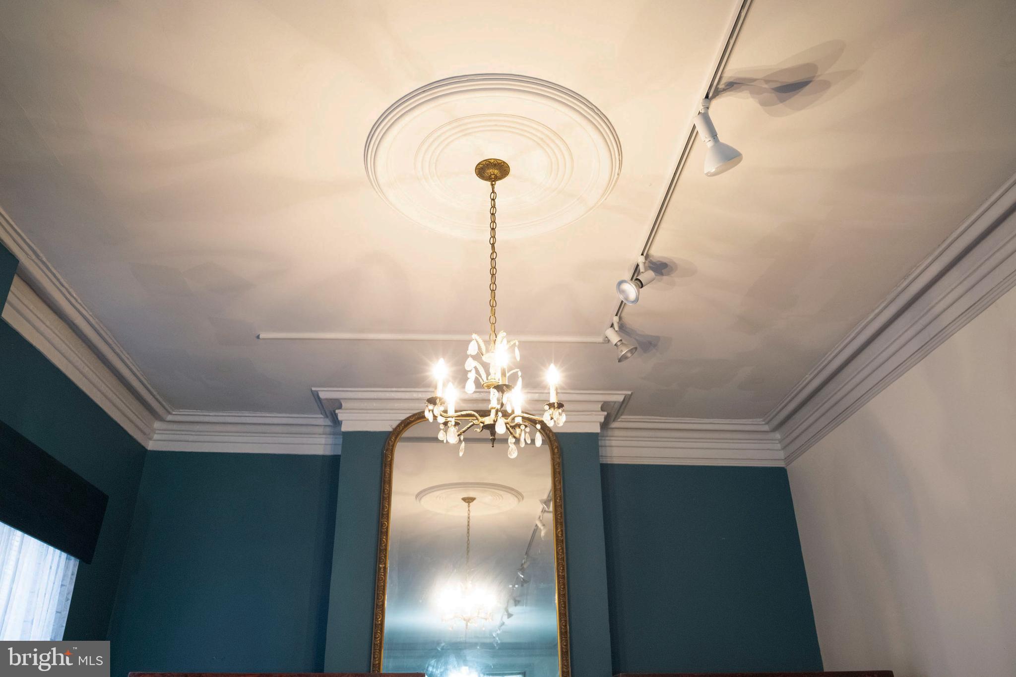 19 South Stricker Street Baltimore, MD 21223 - Photo 29 of 55 a view of a room with a chandelier fan and wooden floor