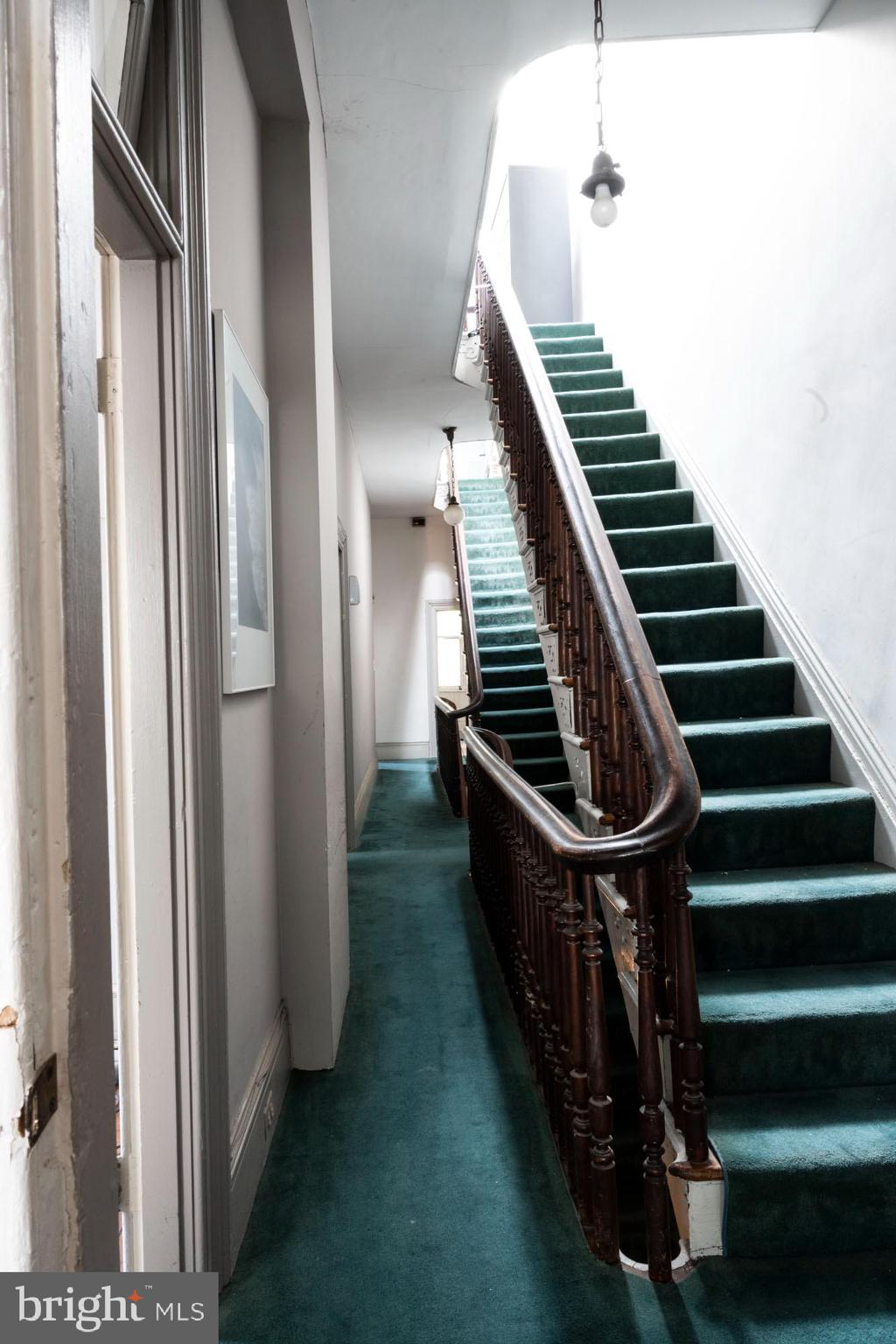 19 South Stricker Street Baltimore, MD 21223 - Photo 31 of 55 a view of entryway and hall with wooden floor