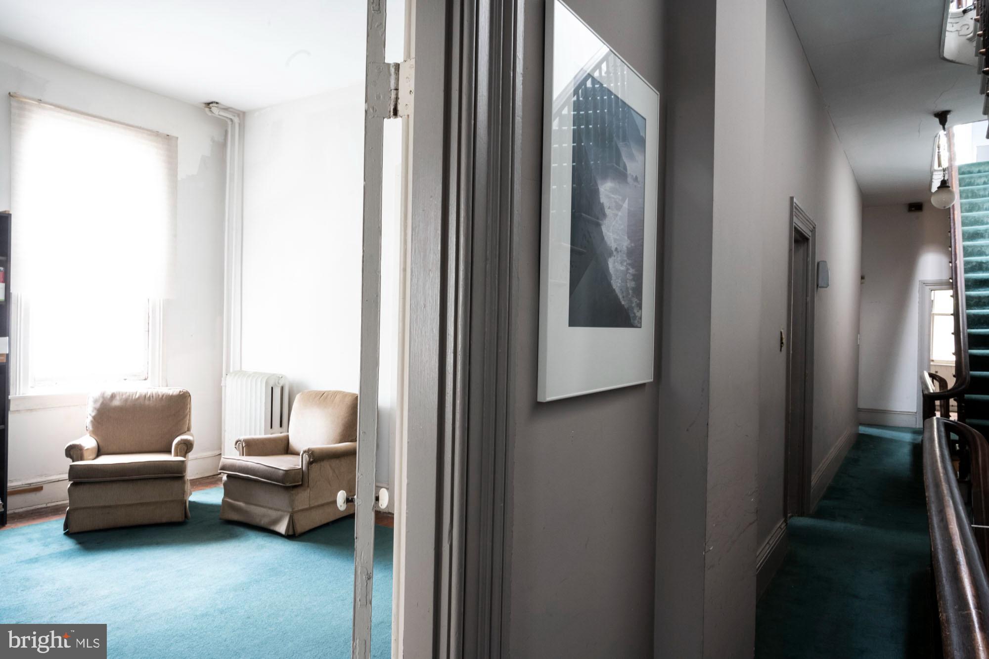 19 South Stricker Street Baltimore, MD 21223 - Photo 34 of 55 a living room with furniture and a window