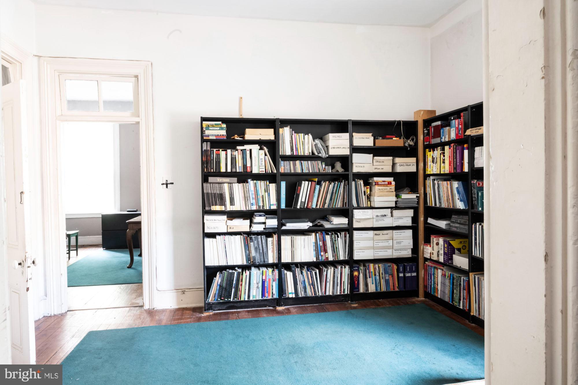 19 South Stricker Street Baltimore, MD 21223 - Photo 38 of 55 a view of an empty room with window and shelf