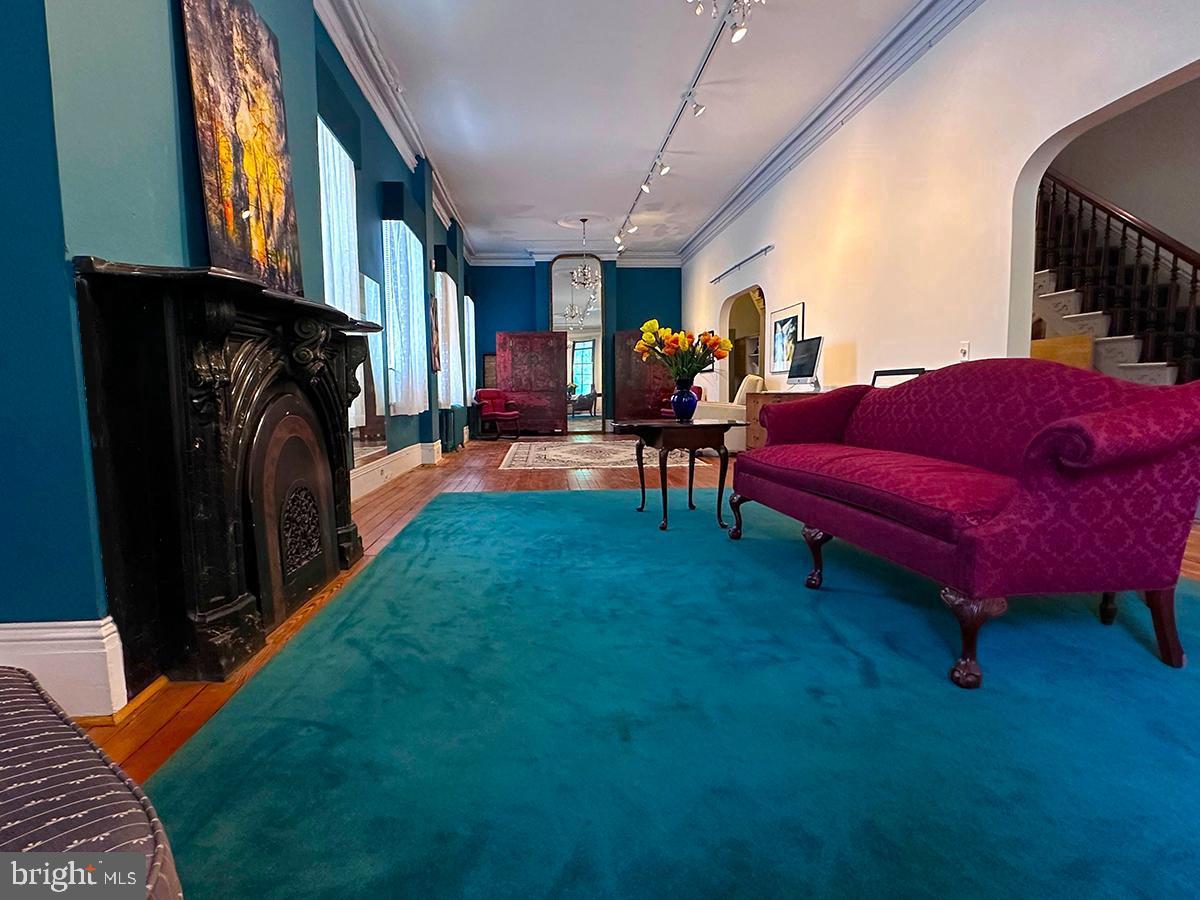 19 South Stricker Street Baltimore, MD 21223 - Photo 4 of 55 a living room with furniture and a fireplace