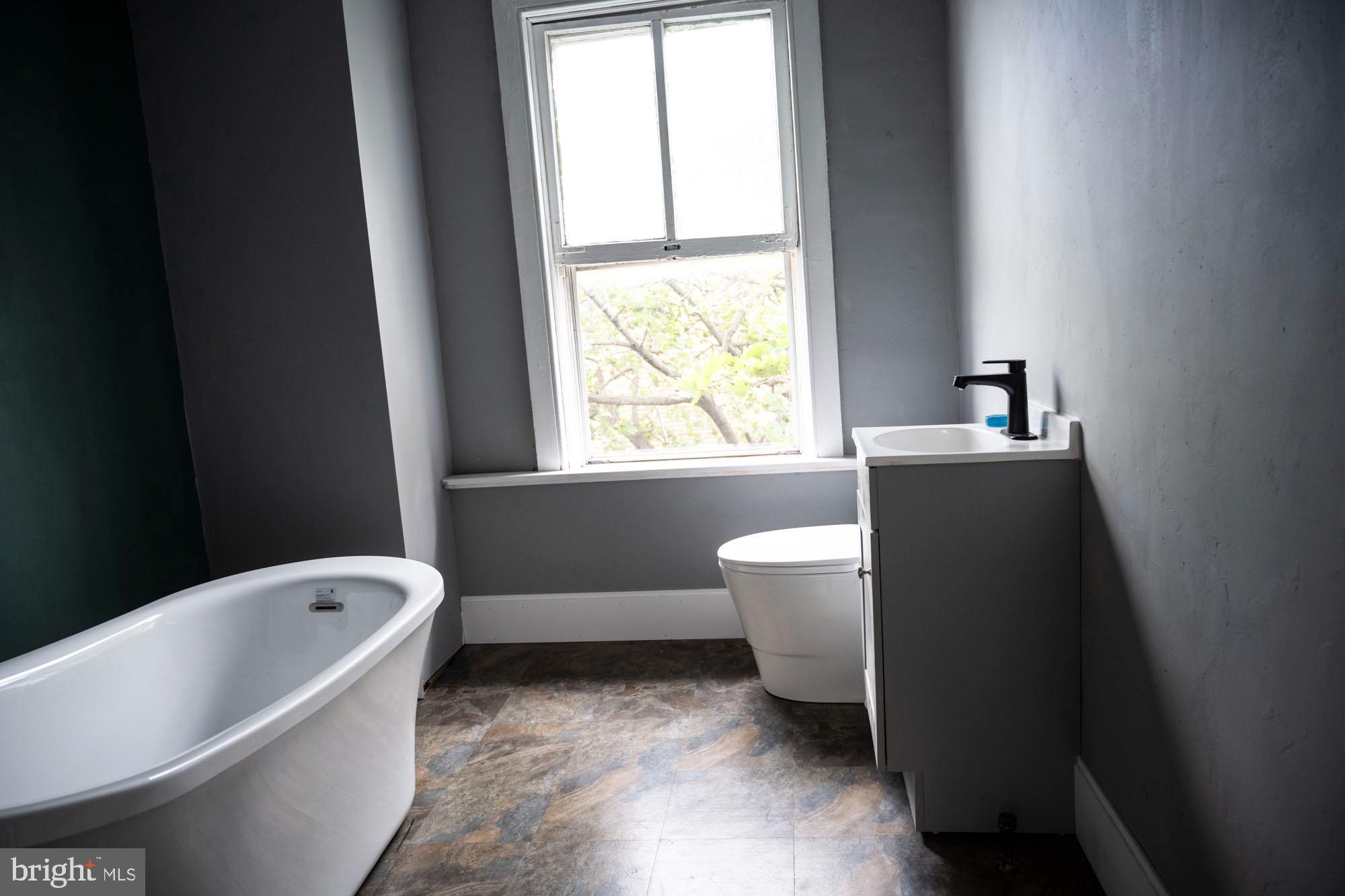 19 South Stricker Street Baltimore, MD 21223 - Photo 43 of 55 a bathroom with a bathtub sink and toilet