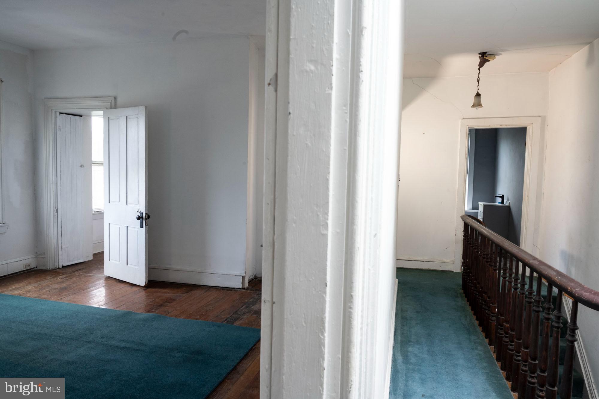 19 South Stricker Street Baltimore, MD 21223 - Photo 46 of 55 a view of hallway with wooden floor