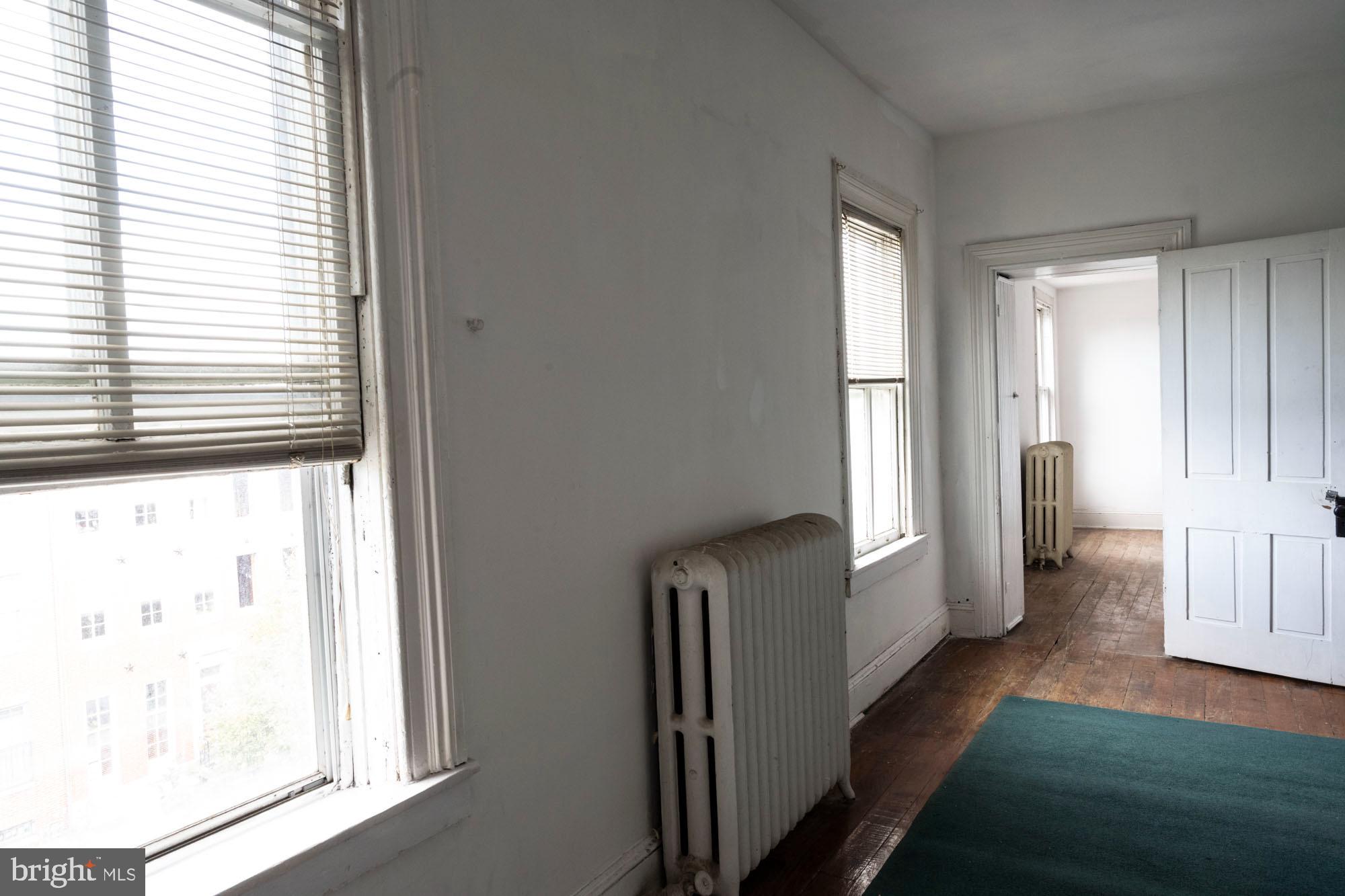 19 South Stricker Street Baltimore, MD 21223 - Photo 47 of 55 a view of hallway with furniture and a window