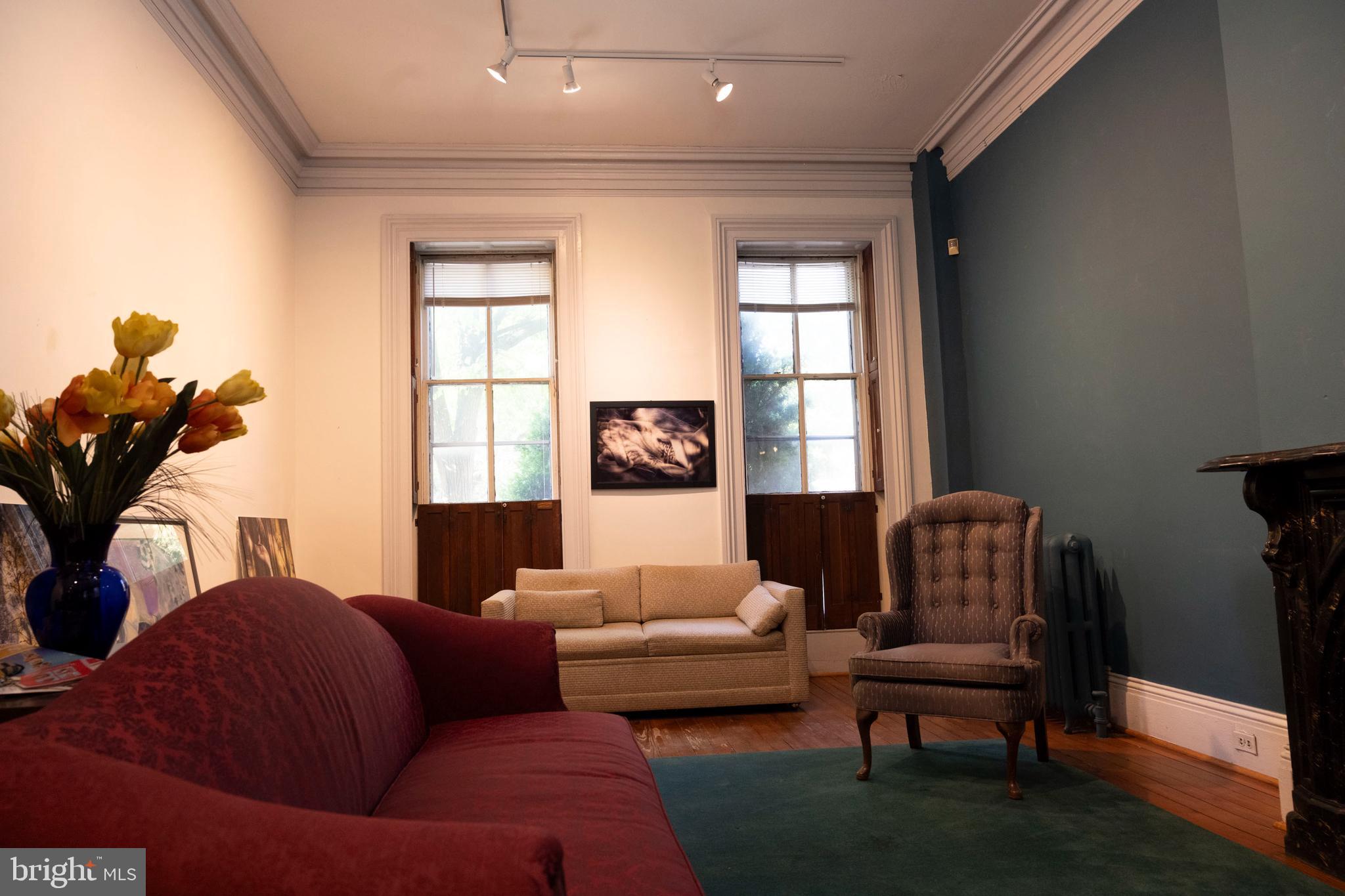 19 South Stricker Street Baltimore, MD 21223 - Photo 8 of 55 a living room with furniture and a window