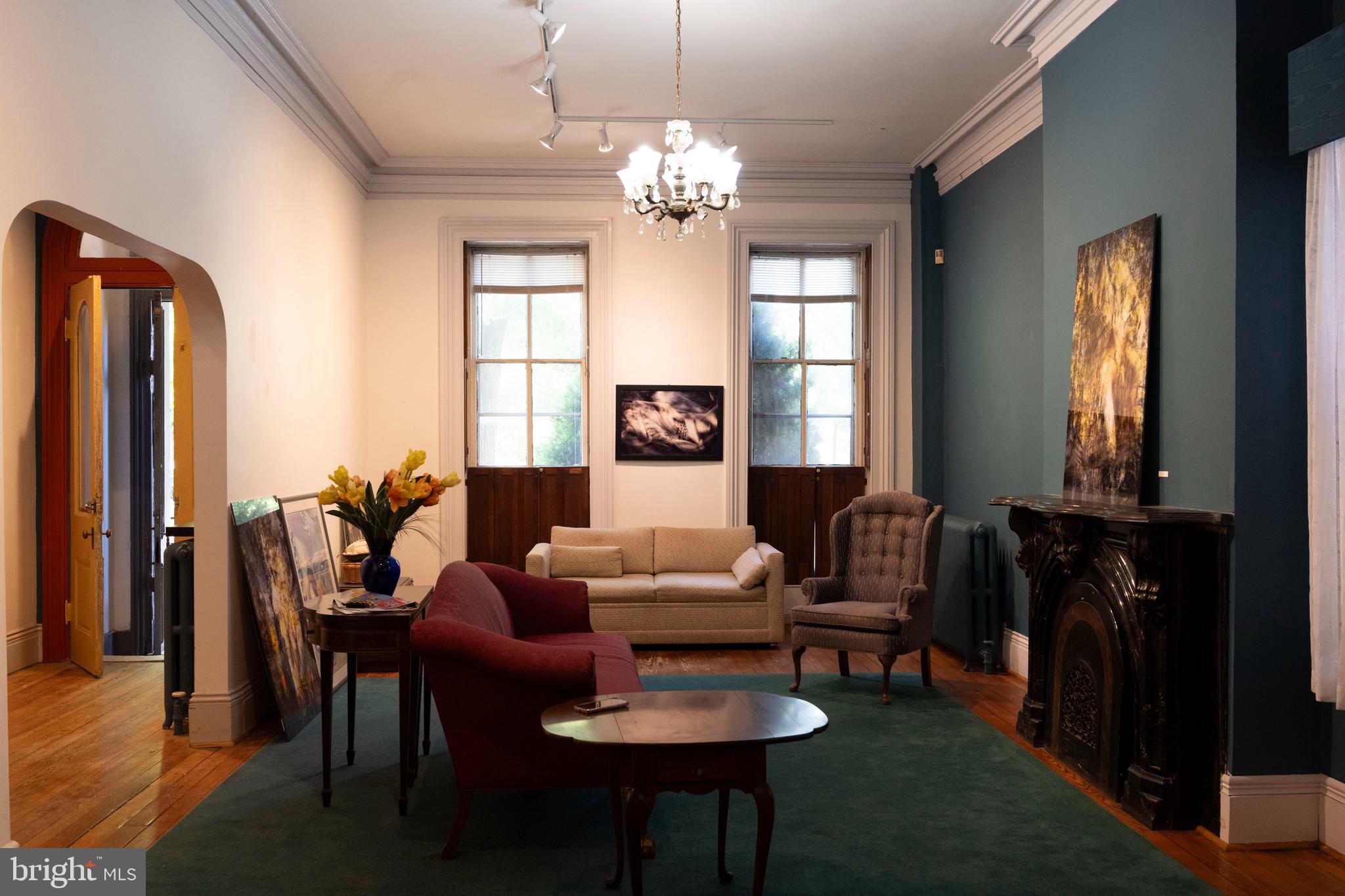 19 South Stricker Street Baltimore, MD 21223 - Photo 9 of 55 a living room with furniture and a chandelier
