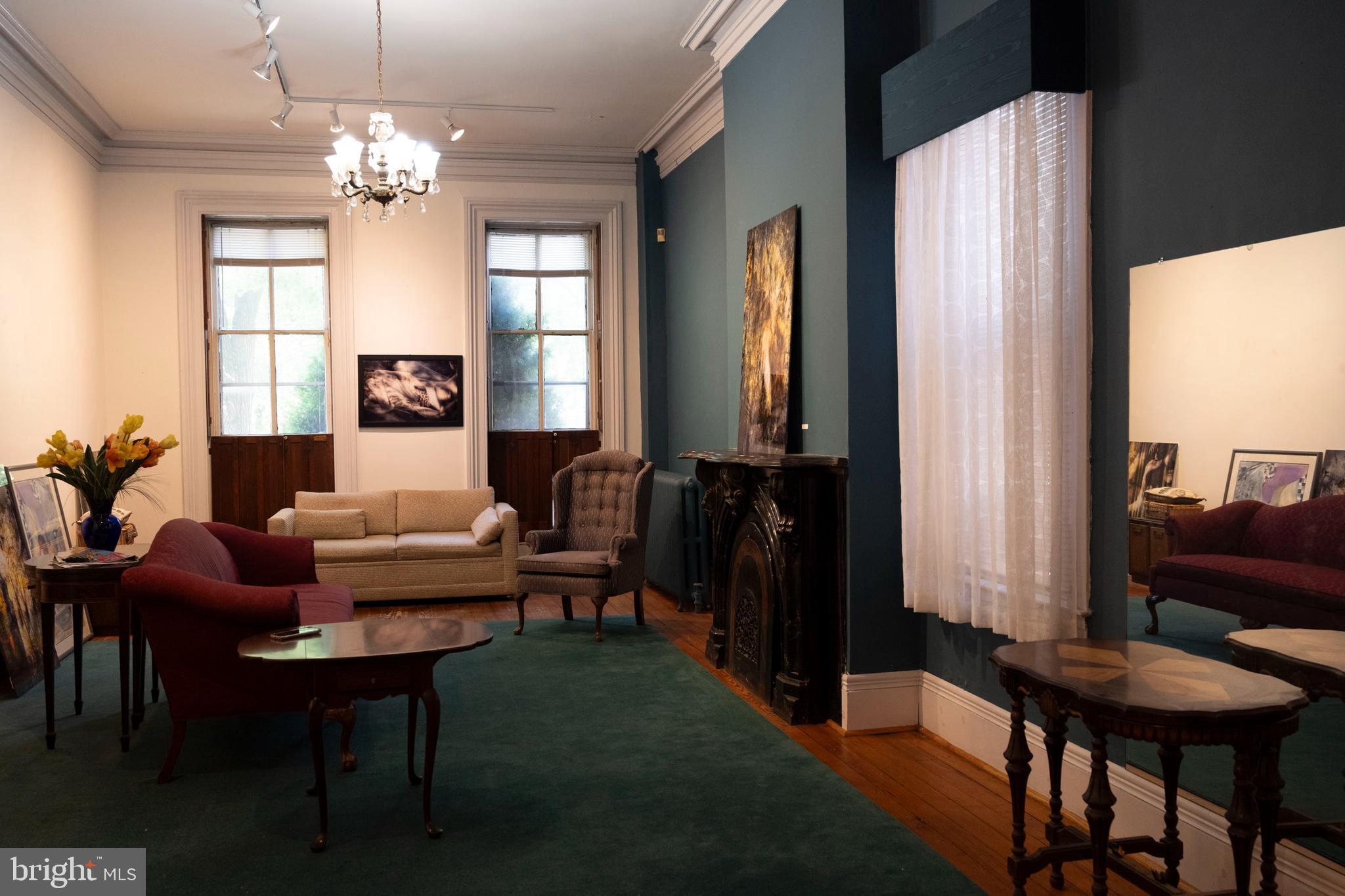 19 South Stricker Street Baltimore, MD 21223 - Photo 10 of 55 a living room with furniture and a chandelier