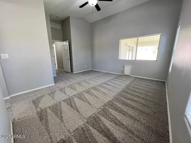 a spacious bathroom with a toilet a sink and mirror