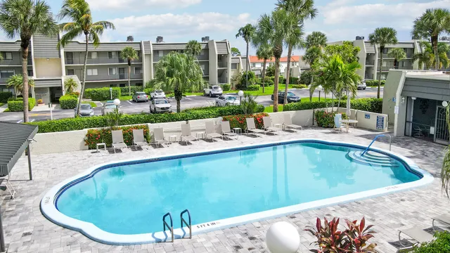 a view of a swimming pool with a patio