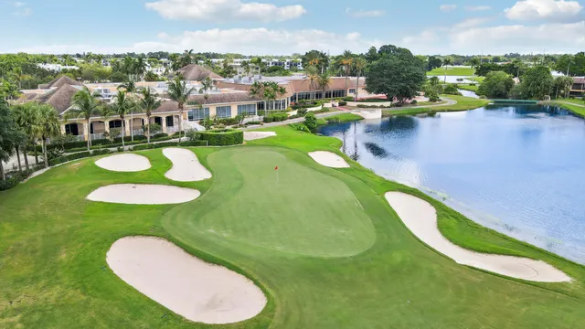 a view of a swimming pool with a yard