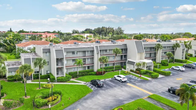 a view of a house with a yard and plants