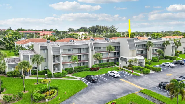 a view of a house with a yard and plants